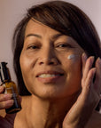 Old woman happy using Night Facial Cream - Gotu Kola & Sericin - Font side