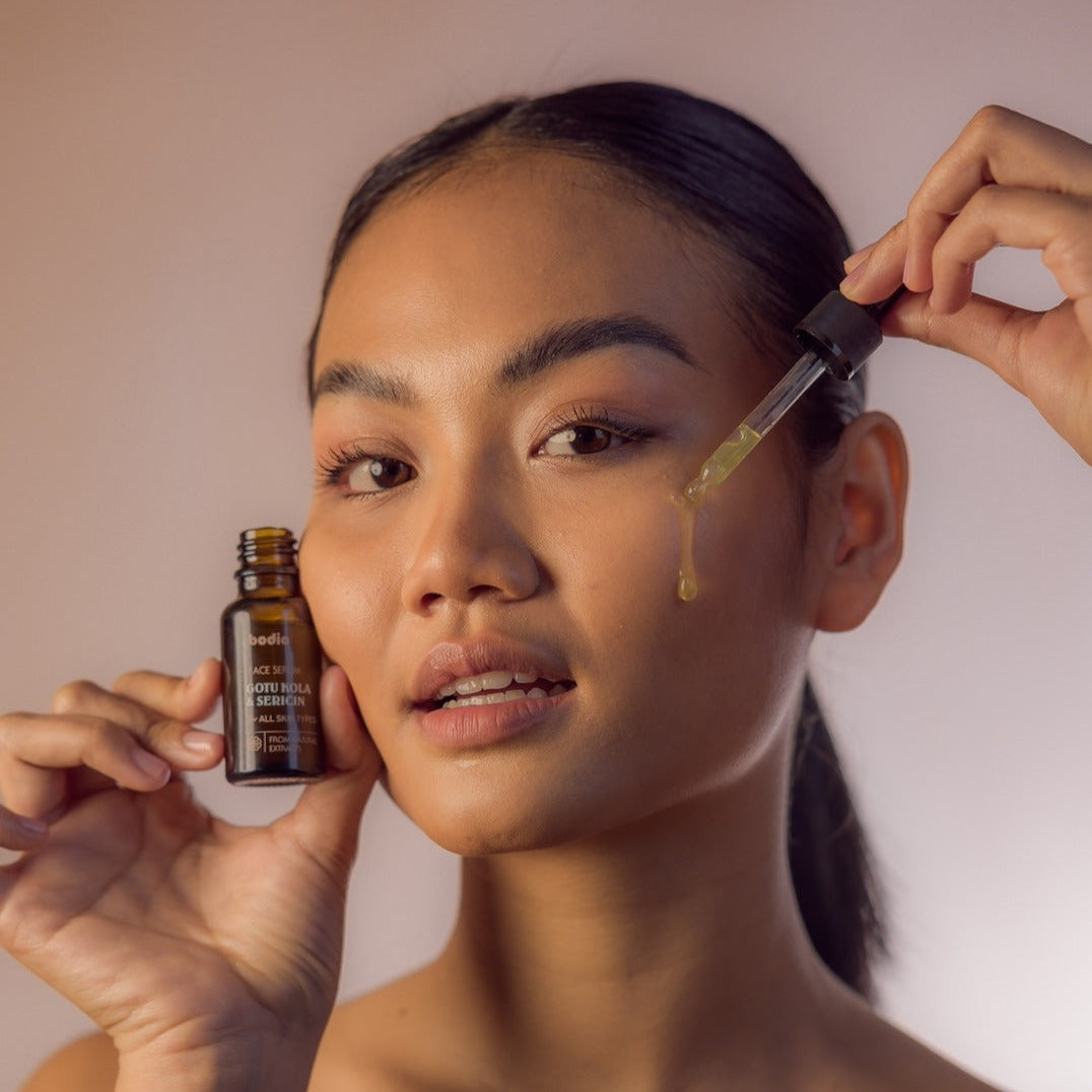 Young Woman Happy using Face Serum - Gotu Kola & Sericin