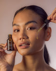 Young Woman Happy using Face Serum - Gotu Kola & Sericin