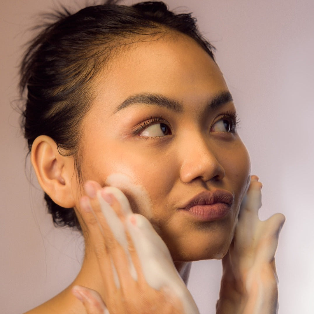 Young Woman cute face using Facial Cleansing Foam - Gotu Kola &amp; Sericin