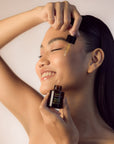 Young Woman using Face Oil Serum - Plant Elixir Facial Serum