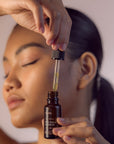 Young Woman using Face Serum - Gotu Kola & Sericin - Left Side