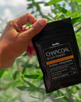 packaging charcoal powder face mask coconut natural bodia apothecary in hand