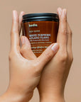Body butter bodia white turmeric & ylang cream nourish & intensely repair packshot in hand