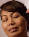 Old Woman using Face Oil Serum - Plant Elixir Facial Serum