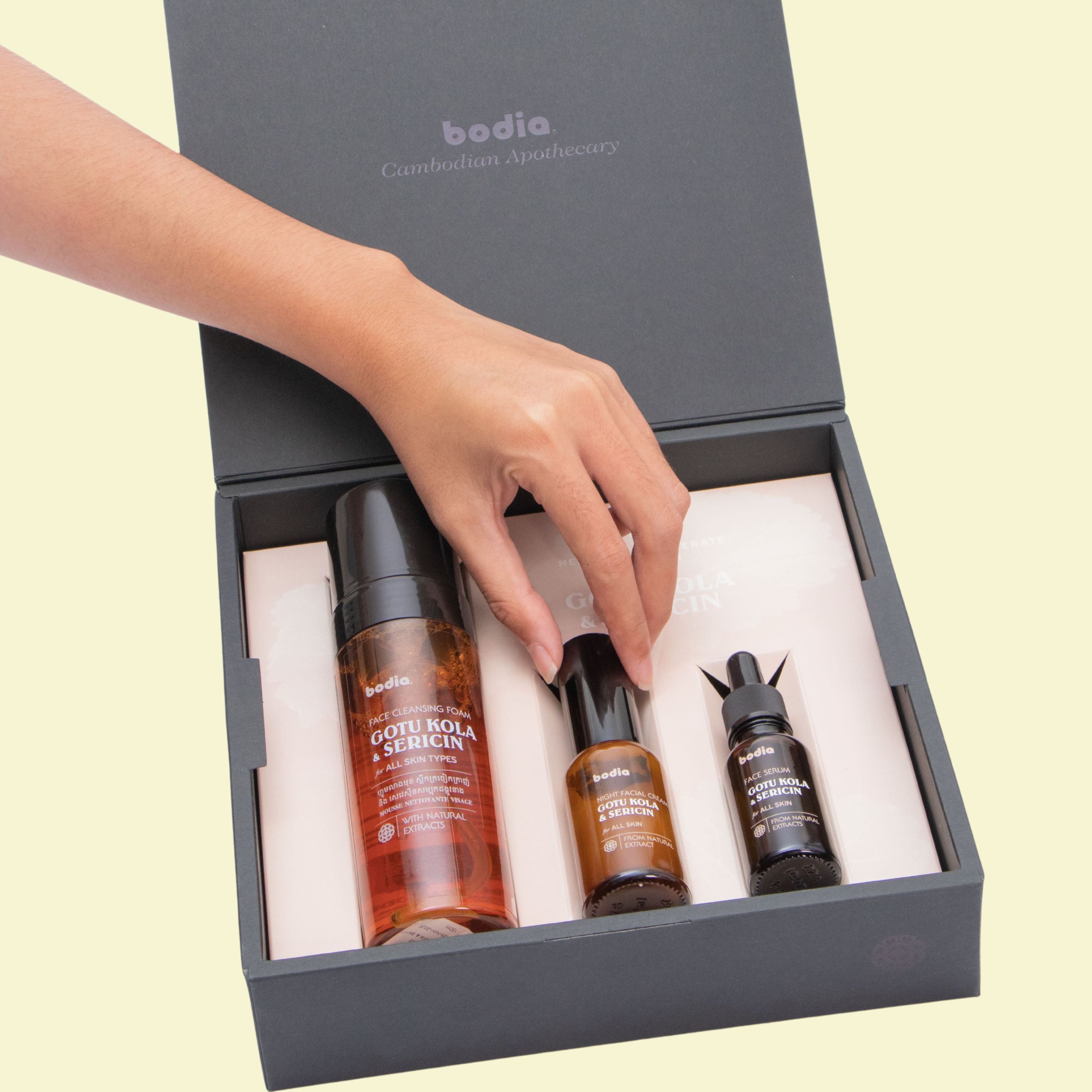 Woman hand picking Gotu Kola and sericin set by bodia