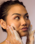 Young Woman cute face using Facial Cleansing Foam - Gotu Kola & Sericin