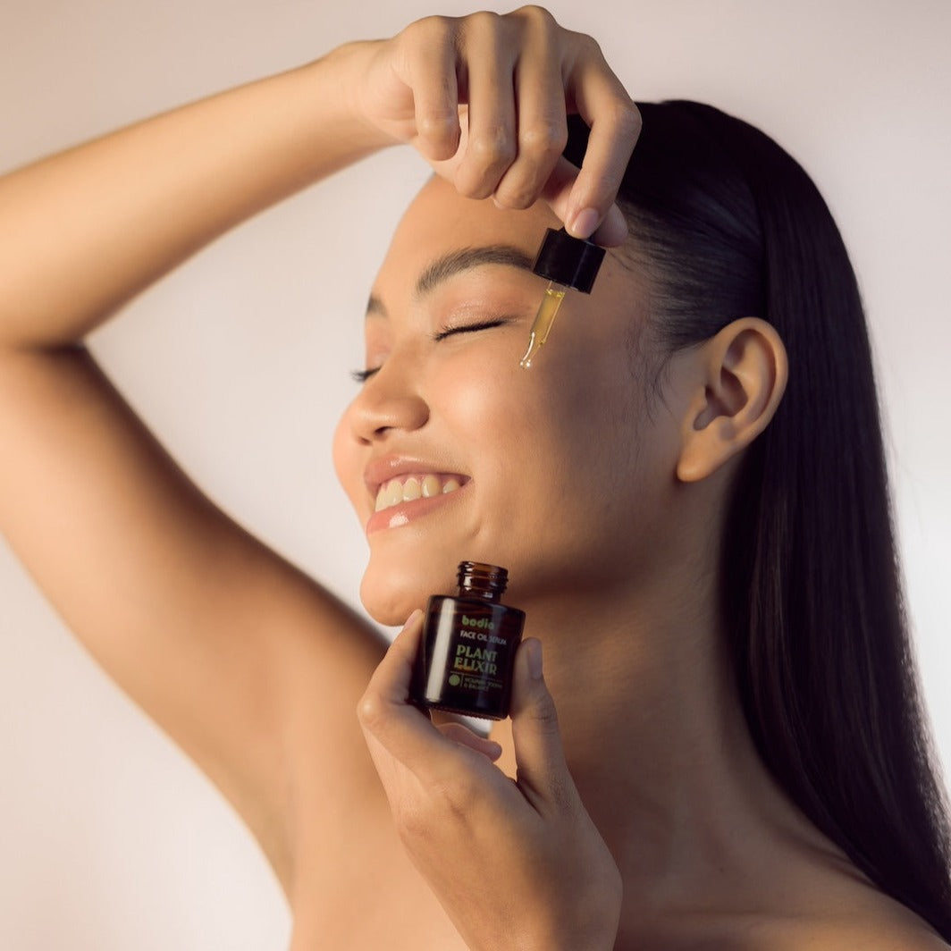 Young Woman using Face Oil Serum - Plant Elixir Facial Serum