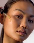 Young Woman using Face Serum - Gotu Kola & Sericin - Front Side