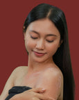 Young Woman happy using Bodia Rice Scrub - Jasmine & Rose