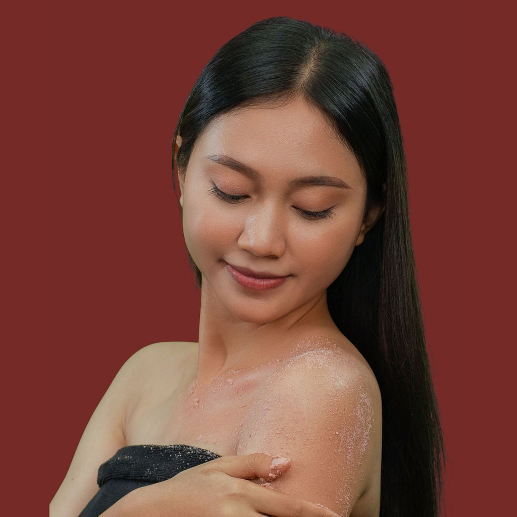 Young Woman happy using Bodia Rice Scrub - Jasmine & Rose