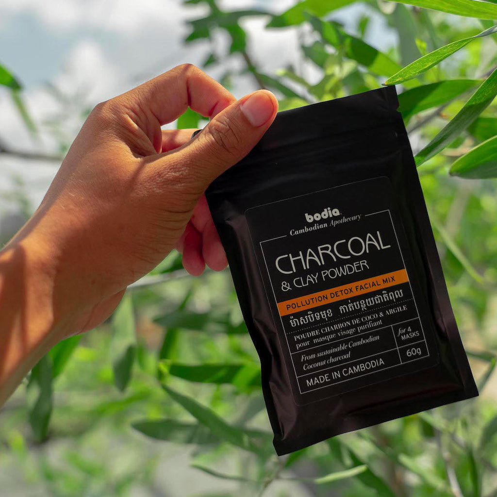 packaging charcoal powder face mask coconut natural bodia apothecary in hand